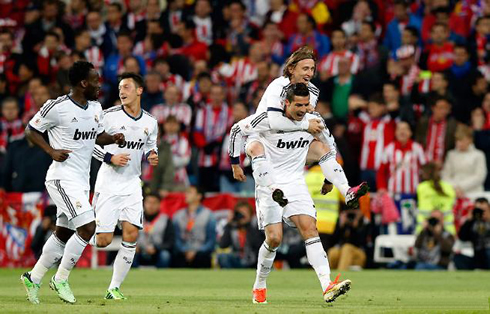 Luka Modric jumping to Cristiano Ronaldo back, after the Portuguese scored the opener in Real Madrid 1-2 Atletico Madrid, for the Copa del Rey 2013