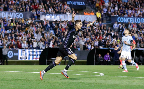 Cristiano Ronaldo raises his two arms in the air after scoring against Celta de Vigo