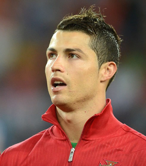 Cristiano Ronaldo looking above with a new haircut ready for the EURO 2012