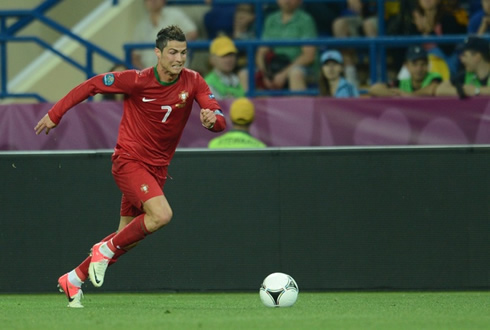 Cristiano Ronaldo runninga after the ball in a game for Portugal at the EURO 2012