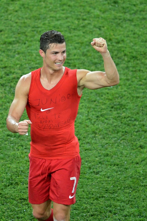 Cristiano Ronaldo showing his biceps muscles, as he shows a message to his son, on his sleeveless shirt at the EURO 2012