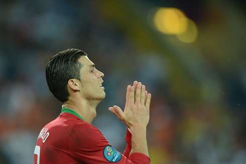 Cristiano Ronaldo praying during a game for Portugal at the EURO 2012