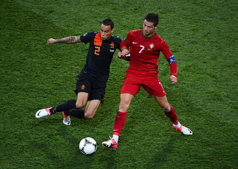 Cristiano Ronaldo dribbling a Dutch defender in Portugal 2-1 Netherlands, at the EURO 2012