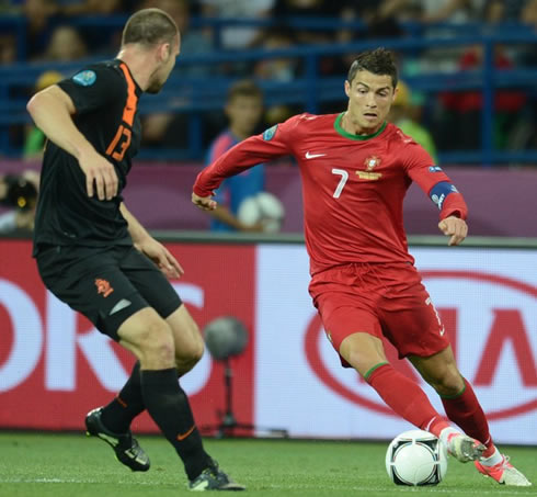 Cristiano Ronaldo taking on a Dutch defender in the EURO 2012