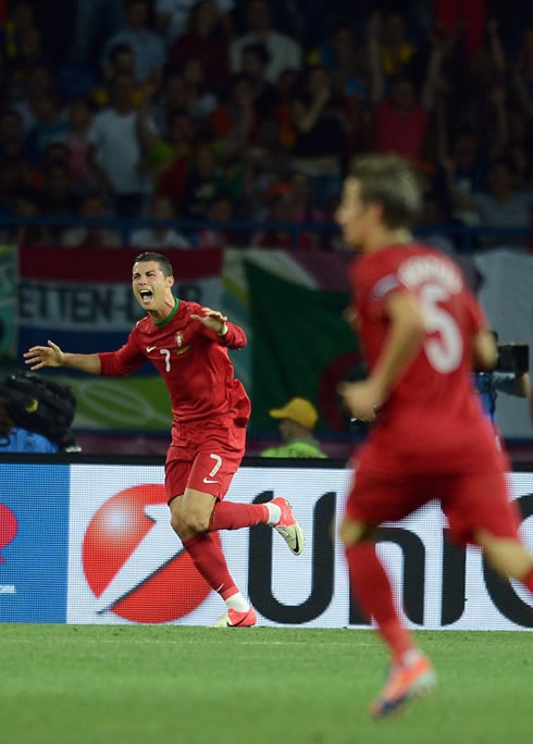 Cristiano Ronaldo and Fábio Coentrão prepare to celebrate Portugal goal against the Netherlands in the EURO 2012