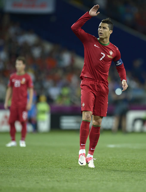 Cristiano Ronaldo waving his arm and compaining with the referee, in Portugal 2-1 Holland at the EURO 2012