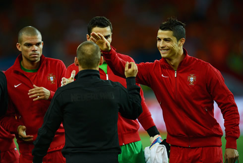 Cristiano Ronaldo smiling and greeting Wesley Sneijder before Portugal takes on Holland for the EURO 2012