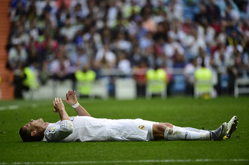 Cristiano Ronaldo stretched on the ground after suffering a minor injury in a Real Madrid league match in 2015