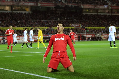 Cristiano Ronaldo celebrating a Real Madrid goal in the red jersey uniform