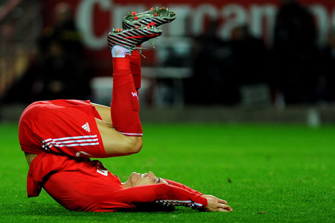 Cristiano Ronaldo funny position, by putting his feet up, with his back on the ground