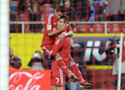 Cristiano Ronaldo holds Angel Di María on his lap
