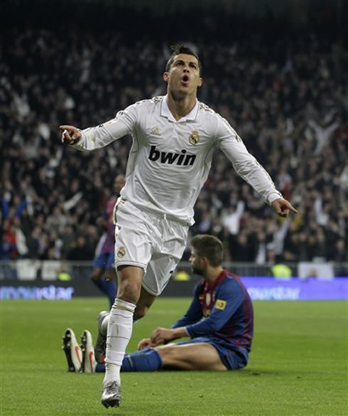 Cristiano Ronaldo puts Piqué on the ground after blasting a left-foot strike for the 1st goal of the night, in Real Madrid vs Barcelona