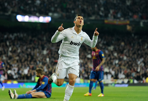 
Cristiano Ronaldo points his fingers to the sky, as he celebrates his great goal against Barcelona, in 2011/2012