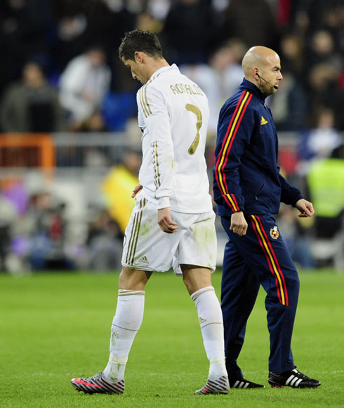 Cristiano Ronaldo walks away looking down, in a Real Madrid vs Barcelona Clasico in 2012