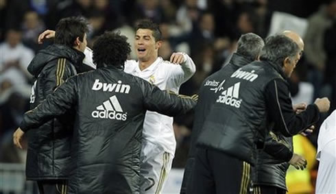 Cristiano Ronaldo goes celebrate his Real Madrid goal against Barcelona with his teammates on the bench, Ricardo Kaká and Marcelo, in 2012