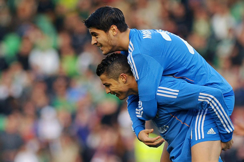 Cristiano Ronaldo holds Alvaro Morata on his back, after assisting for his goal