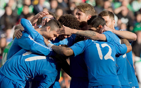 Real Madrid players wearing a blue jersey kit, in La Liga 2014