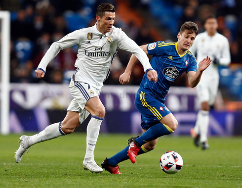 Cristiano Ronaldo running the ball ahead of him