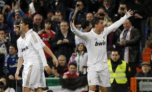 Cristiano Ronaldo turning to the Santiago Bernabéu crowd and raising his arms, in a La Liga game in 2012