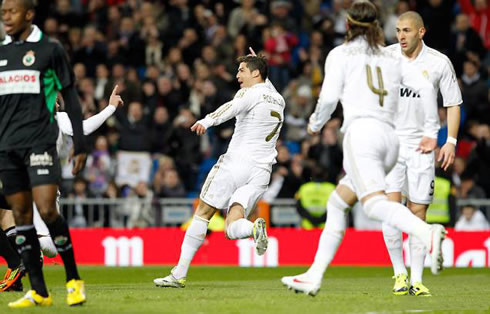 Cristiano Ronaldo starts running away to prepare his goal celebration, while Sergio Ramos chases him and Benzema doesn't look too worried in joining them