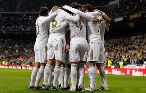 Real Madrid players group hug, showing their unity and team spirit, in La Liga 2011-2012
