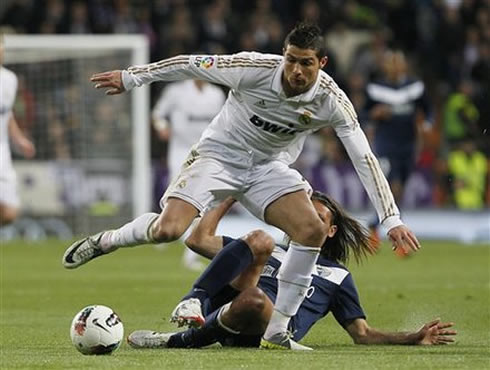 Cristiano Ronaldo getting past a defender against Malaga