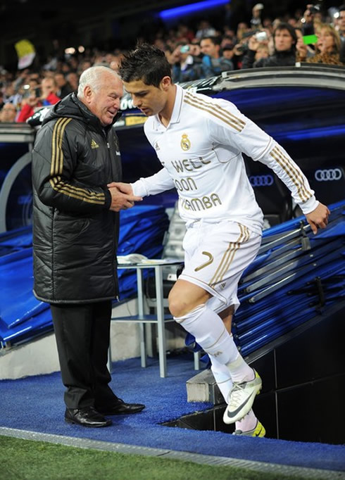 Cristiano Ronaldo wearing a Muamba shirt with an 'Get Well Soon' message writen