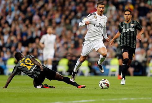 Cristiano Ronaldo sprinting past a defender in Real Madrid 3-1 Malaga