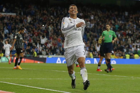 Cristiano Ronaldo running towards the crowd in the Santiago Bernabéu after scoring for Real Madrid