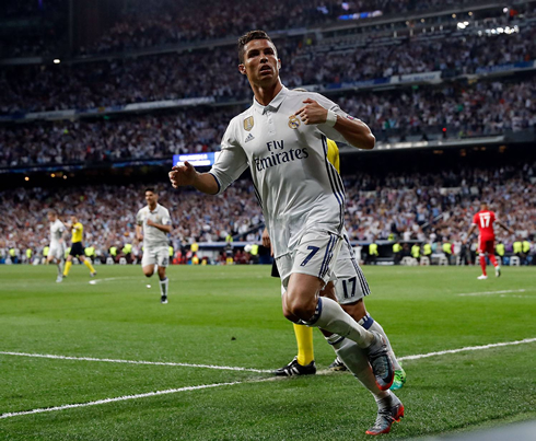 Cristiano Ronaldo points to Real Madrid badge after scoring in Real Madrid 4-2 Bayern Munich