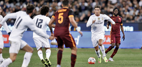 Cristiano Ronaldo moving the ball forward in an attacking action of a pre-season friendly between Real Madrid and AS Roma