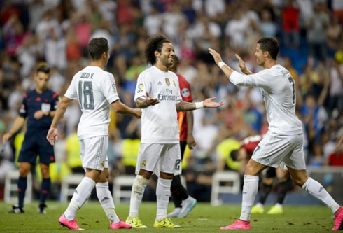 Cristiano Ronaldo smiling and congratulating Marcelo for his goal against Galatasaray