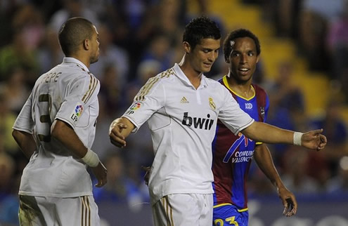 Cristiano Ronaldo smiling while near Pepe, after suffering a foul against Levante match for the Spanish League La Liga