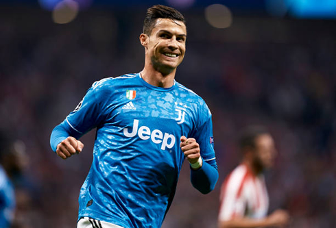 Cristiano Ronaldo smiling during his Champions League game against Atletico Madrid