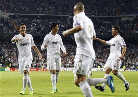 Real Madrid players joining celebrations as they scored another goal in the UEFA Champions League game against Lyon, in the 2011/2012 season