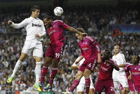 Cristiano Ronaldo heading the ball to the far post, allowing Benzema to score