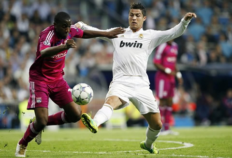 Cristiano Ronaldo stealing the ball to a defender