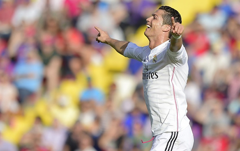 Cristiano Ronaldo opens his arms as he celebrates Real Madrid goal against Levante