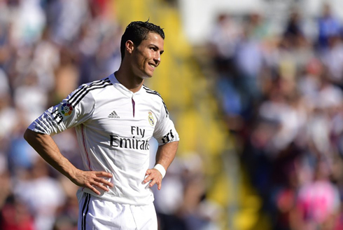 Cristiano Ronaldo puts his hands on his waist and puts a cynical smile on his face