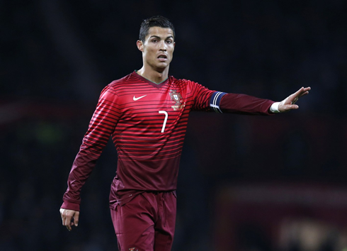 Cristiano Ronaldo passing instructions to his Portuguese teammates on the field