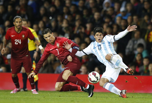 Cristiano Ronaldo giving his all in a loose ball in Portugal vs Argentina
