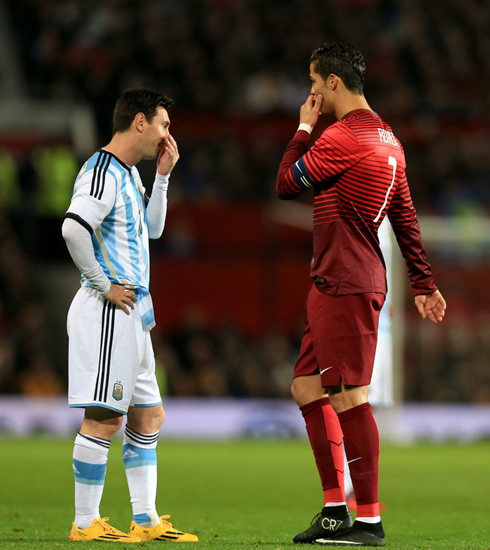 Messi and Ronaldo talking to each other in secret, during the match between Portugal and Argentina played at Old Trafford
