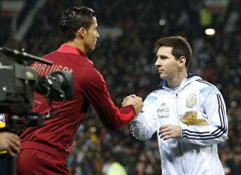Cristiano Ronaldo shaking hands with Lionel Messi ahead of a Portugal vs Argentina in 2014