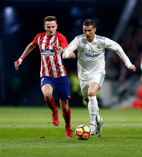Cristiano Ronaldo running away from an opponent in Atletico vs Real Madrid in 2017