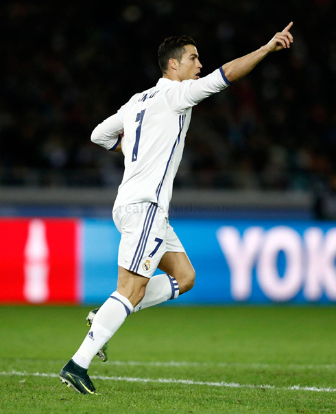 Cristiano Ronaldo brings the ball under his arm after scoring for Real Madrid