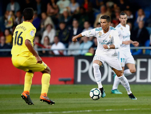 Cristiano Ronaldo taking on a defender in Villarreal vs Real Madrid in 2018