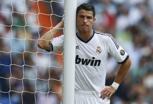 Cristiano Ronaldo looking very thoughtful and sad, near a post during a Real Madrid game in 2012-2013