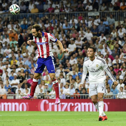 Cristiano Ronaldo staring at an opponent as he hangs in the air