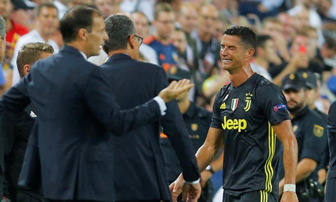 Cristiano Ronaldo crying near Massimiliano Allegri, as he leaves the pitch at the Mestalla