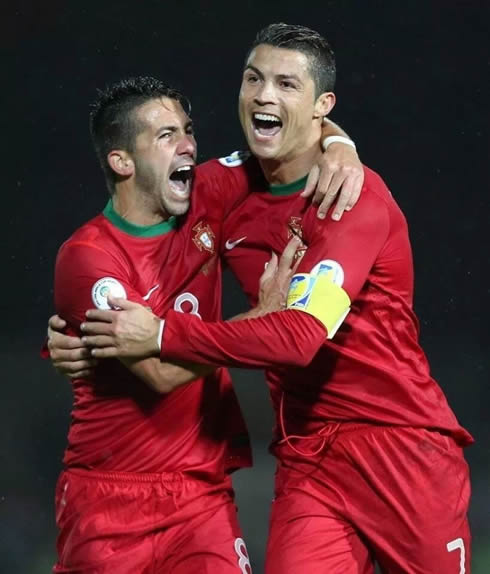 Cristiano Ronaldo and João Moutinho celebrating Portugal victory in 2013-2014